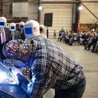 A welder authenticates the keel of LCS 27, the future USS Nantucket, by welding the initials of ship sponsor Polly Spencer. Pic: Lockheed Martin Nantucket