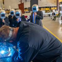 A welder authenticates the keel of Littoral Combat Ship (LCS) 31, the future USS Cleveland, by welding the initials of the ship’s sponsor, Robyn Modly, wife of a Clevelander and former U.S. Navy Secretary, who has embraced the city as her own. (Photo: Lockheed Martin)