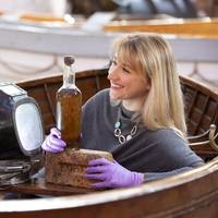 Abigail McIntyre, Senior Curator at the Scottish Maritime Museum, pictured with an eighty year old bottle of Scottish whisky salvaged from the 1923 SS Politician, one of Scotland’s most famous shipwrecks and the inspiration for the much-loved Ealing Studio comedy Whisky Galore! The whisky bottle, which was acquired by the Scottish Maritime Museum with the support of the National Fund for Acquisitions at The Grand Whisky Auction, will become part of the Museum’s nationally recognized collection o