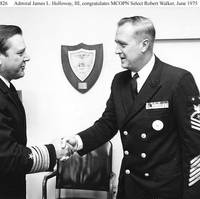 Adm. James L. Holloway III congratulates Master Chief Petty Officer of the Navy Robert Walker, June 1975. (U.S. Navy photo)