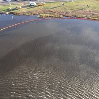 Aerial view of the oil spill near the Ronald Reagan Washington National Airport, Oct. 30, 2015. A safety zone was established with a 1,500-yard radius from source of the spill. (U.S. Coast Guard photo by Nicholas Rodriguez)