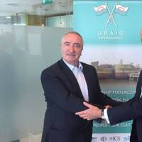 Alasdair Evitt, Group Director, Ship Management East, V.Group shakes hands with Hugh Williams, Chief Executive Officer, Graig Shipping Plc following announcement to employees in Cardiff and Shanghai (Photo: V.Group)
