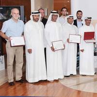 Amer Ali, Executive Director, Dubai Maritime City Authority, among marine driver’s license holders with senior officials in DMCA during the ceremony at DMCA headquarters.
