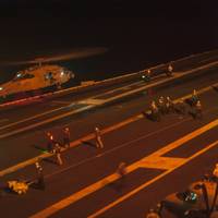 An MH-60S Sea Hawk helicopter from the Red Lions of Helicopter Sea Combat Squadron (HSC) 15 lands on the flight deck of the Nimitz-class aircraft carrier USS Carl Vinson (CVN 70) during search and rescue operations for the pilot of one of two F/A-18 Hornets which crashed earlier in the day while operating from the ship. The other pilot was located and returned to Carl Vinson for medical care. (U.S. Navy photo by John Philip Wagner, Jr.)
