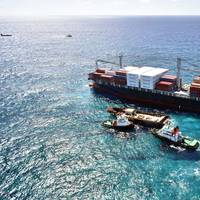 Ardent’s salvage crews work from their reconfigured sea base next to the Kea Trader, a stranded cargo vessel in New Caledonia. (Photo: Ardent)