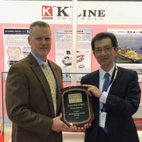 At the Sea Japan exhibition in Tokyo, Toyohisa Nakano, (right) Executive Officer, K Line, accepts a "Great Ship of 2017" award from Maritime Reporter & Engineering News Editor and Associate Publisher Greg Trauthwein. (Photo: Rob Howard)