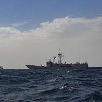 Bajamar Expess trimaran being escorted by the Spanish frigate ESPS Santa Maria