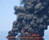 Black smoke billows from a controlled burn of surface oil during the 2010 Deepwater Horizon oil spill. A new study by NOAA and the Cooperative Institute for Research in Environmental Sciences (CIRES) found that controlled burns released more than one million pounds of sooty black carbon into the atmosphere.
