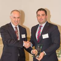 Bouchard Transportation Co., Inc. Vice President of Operations & Sales Morty Bouchard IV accepts the AMS Tug & Barge Safety Award from AMS President Lee Seham at the American Maritime Safety 25th Annual Membership Meeting on Thursday, October 23, 2014 (Photo: AMS)