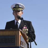 Capt. Brett Crozier addresses the crew for the first time as commanding officer of the aircraft carrier USS Theodore Roosevelt (CVN 71) during a change of command ceremony in November 2019. (U.S. Navy photo by Sean Lynch)