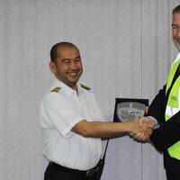 Capt. Guillermo Endozo (left) accepting a commemorative plaque from Gary Lemke, EVP Ports, Abu Dhabi Ports