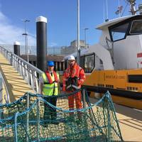Captain Jeff Gaskin, Aberdeen Harbour Master, and Adam Ezzamel, EOWDC Project Director, Vattenfall, on the new pontoon Photo Aberdeen Harbor )