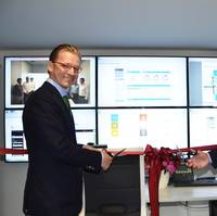 Christian Rychly, Managing Director of Leonhardt & Blumberg (left) and Knut Ørbeck-Nilssen, CEO of DNV GL – Maritime (right) cut the ribbon. (Photo: DNV GL)