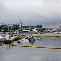 Clean-up efforts are underway after a 100-foot yacht caught fire in Marina del Rey, Calif. (Photo: Frank Lower / U.S. Coast Guard)
