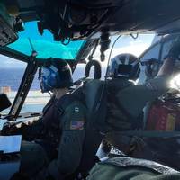 Coast Guard air crew prepare to conduct a medevac of a mariner 100 miles northwest of Oahu, December 4, 2020. (U.S. Coast Guard photo courtesy of Air Station Barbers Point)