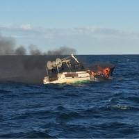 Coast Guard Sector Long Island Sound were notigied that the 50-foot long liner Long Shot was burning near Fisher’s Island. The crewmembers had abandoned ship and boarded a life raft. Photo USCG.