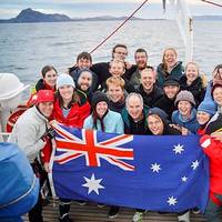 Commanding Officer of STS Young Endeavour, Lieutenant Commander Gavin Dawe OAM RAN (front, centre), and World Voyage Passage One Youth Crew celebrate rounding Cape Horn on Australia Day 2015.