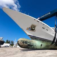 Coral Ocean is hauled out of the water for service at Derecktor Ft. Pierce. Measuring 73 meters long and weighing nearly 1,300 tons, Coral Ocean is the largest yacht ever to be hauled using strap lift technology anywhere in the world. (Photo: Derecktor Ft. Pierce)