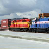 Crowley containers aboard the FEC Train during the recent opening ceremony of the new intermodal container transfer facility adjacent to Crowley's Port Evergaldes terminal. (Photo courtesy of Crowley)