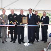 Cutting the ribbon, from left, Dominic Galluci, P&S Construction; RI Congressman James Langevin; RI Governor Lincoln Chafee; Rear Adm. Michael Jabaley, commander, NUWC; Capt. Todd Cramer, commander, NUWC Division Newport; Mark Rodrigues, head NUWC's Platform and Payload Integration Department; Blair Decker, General Dynamics/Electric Boat; and RI Senator Jack Reed.