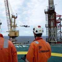 Cyberhawk team operating a drone offshore Photo Cyberhawk