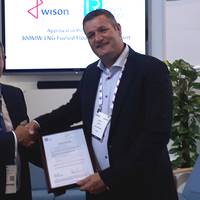 David Barrow, LR Commercial Director – Marine & Offshore presents the AiP to Maarten Spilker, Wison Solutions Director at Gastech this week in Barcelona. (Photo: Lloyd’s Register)