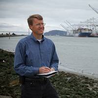 Sandia National Laboratories researcher Joe Pratt stands near the Port of Oakland, one of the west coast ports he studied to learn whether hydrogen fuel cells are a viable power source for docked ships. (Photo by Steffan Schulz)