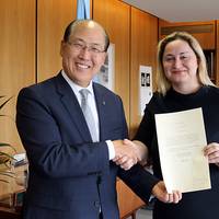 Dilek Ayhan, State Secretary in the Norwegian Ministry of Trade, Industry and Fisheries, hands over the instrument of ratification of the 2010 HNS Protocol to Kitack Lim, Secretary-General, IMO. (Photo: IMO)
