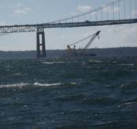 Donjon’s Chesapeake 1,000 heavy lift crane works to salvage a sunken barge under the Newport Pell Bridge in Newport, Rhode Island last November.