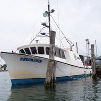 Endorphin, a 58-foot commercial fishing vessel moored to a pier in Montauk, N.Y. (USCG Photo. July, 2006)