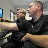 Eric Larsson and Stephen Polk working together at SCI's Center for Maritime Education in Houston, TX. Photo courtesy SCI