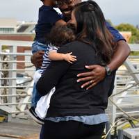Family and friends met aboard the Coast Guard Cutter Bertholf's flight deck to reunite with Bertholf crewmembers following the cutter's return home to Alameda, Calif., after a 90-day deployment, Sept. 4, 2018. Bertholf is one of four 418-foot National Security Cutters homeported in Alameda. U.S. Coast Guard photo by Petty  Family and friends met aboard the Coast Guard Cutter Bertholf's flight deck to reunite with Bertholf crewmembers following the cutter's return home to Alameda, Calif., after a