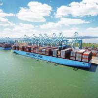 File Image: A typical Maersk boxship works cargo alongside a pier. (CREDIT: Maersk)