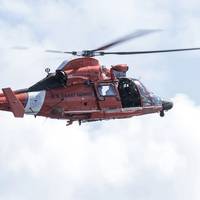 File Image: A USCG rescue copter in the air. (CREDIT: AdobeStock /  © Wollwerth Imagery)
