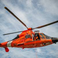 File photo: an MH-65 Dolphin helicopter aircrew from Coast Guard Air Station New Orleans (U.S. Coast Guard photo by Travis Magee)