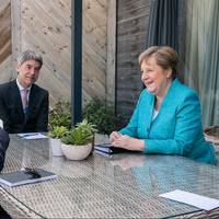 File photo: President Joe Biden meets for a brief pull-aside meeting with German Chancellor Angela Merkel during the G7 Summit at the Carbis Bay Hotel and Estate on Saturday, June 12, 2021, in St. Ives, Cornwall, England. (Official White House Photo by Adam Schultz)