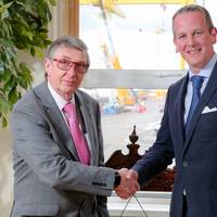 Harland and Wolff’s retiring CEO Robert J Cooper shakes hands with his successor Jonathan Guest (Photo: Harland and Wolff)