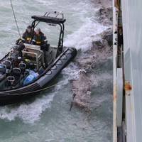 HMAS Melville's Rigid Hull Inflatable Boat prepares to deliver emergency water supplies to Daydream Island as the ship supports the rescue of more than 400 people, following the destruction caused by Tropical Cyclone Debbie. Photo: Royal Australian Navy