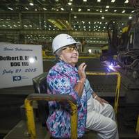 Ima Black reacts after starting a plasma cutter machine at Ingalls Shipbuilding, officially beginning construction of the Arleigh Burke-class destroyer Delbert D. Black (DDG 119), which is named in honor of her late husband. (Photo by Andrew Young/HII)