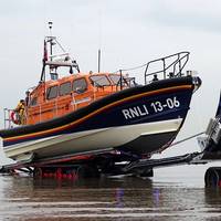 In conjunction with the creation of the new Shannon class lifeboat, the RNLI has also introduced a new launch and recovery tractor, designed in conjunction with high-mobility-vehicles specialist Supacat Ltd, specifically for use with the Shannon. It acts as a mobile slipway.  Pictured is the Hoylake, UK Shannon class lifeboat being recovered from the sea. (Photo: RNLI/Dave James)