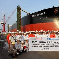 In front of the VLCC Libra Trader, which recently had a new ballast water treatment system installed, representatives of the vessel’s management company, MOL Tankship Management (Asia) Pte Ltd., and the shipyard pose for a commemorative shot.