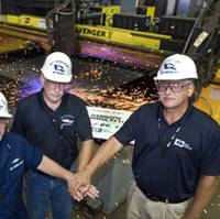Ingalls Shipbuilding celebrated "start of fabrication" for the U.S. Coast Guard National Security Cutter Hamilton (WMSL 753) at its Steel Fabrication Shop in Pascagoula, Miss. Pictured (left to right) are U.S. Coast Guard Lt. Dave Osborne, test lead, hull and electrical; Jim French, deputy program manager, NSC Programs; and Len Janowski, ship design manager, Surface Ship Combatants.