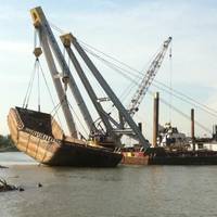 Inland Salvage Raises Scrap Metal Barge on the Mississippi River.