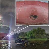 Jalma Topic downriver of the office barge with its port anchor out following contact. Inset shows a close-up of the damage to the vessel’s bulbous bow. (Credit: NTSB, Background source: J. Claverie)​