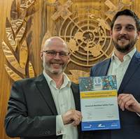 John Dodd, Director of Safety Services and Roger Barry, Safety Engineering Manager, Inmarsat Maritime, with the IMRF Award certificate. Image courtesy Inmarsat
