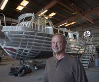 Kerry Neuville with the RORCO crew boat at his New Iberia yard. 