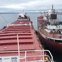 Lightering operations continue while the vessel Roger Blough is anchored in Waiska Bay to transfer its cargo to the Philip R. Clarke and Arthur M. Anderson. (Photo courtesy of Ken Gerasimos, Key Lakes Shipping)