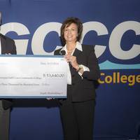 Ingalls Shipbuilding President Brian Cuccias, left, and Mary S. Graham, president of Mississippi Gulf Coast College hold the check representing the donation Ingalls made to MGCCC to purchase welding machines. (Photo: HII)