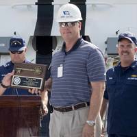 Ingalls Shipbuilding President Brian Cuccias (right) presents a ceremonial key to the National Security Cutter Hamilton (WMSL 753) to Rear Adm. Bruce D. Baffer, the U.S. Coast Guard’s assistant commandant for acquisition and chief acquisition officer, during a delivery ceremony. Also pictured is Capt. Douglas Fears (right), the ship’s prospective commanding officer. Photo by Andrew Young/HII