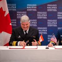 Mario Pelletier, Commissioner of the Canadian Coast Guard and Admiral Linda Fagan, Commandant, United States Coast Guard signing the renewed Canada-United States Joint Marine Pollution Contingency Plan. (Photo: U.S. Coast Guard)